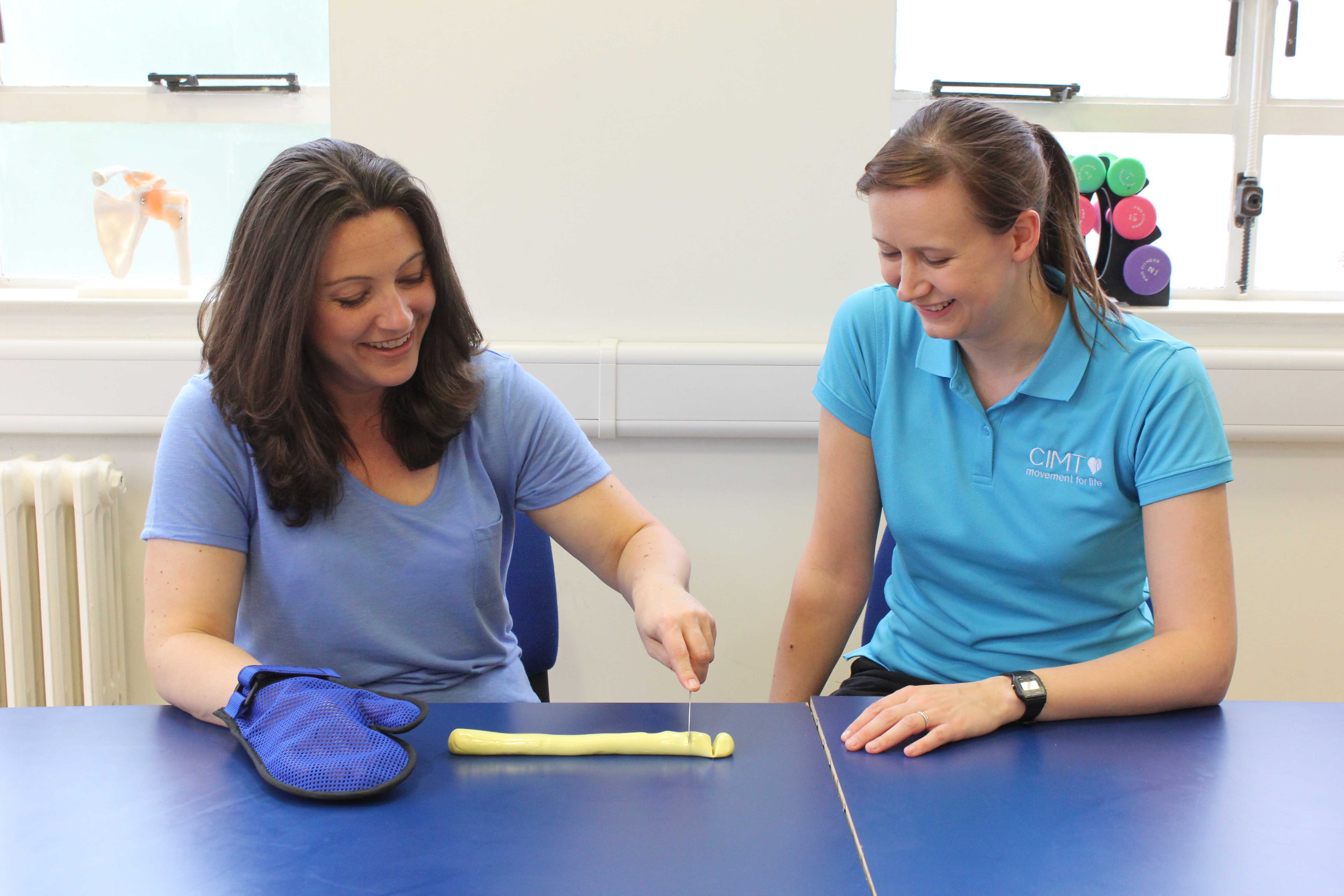One of our adult clients with cerebral palsy undertaking our CIMT porgramme to help her complete tasks like cutting food.