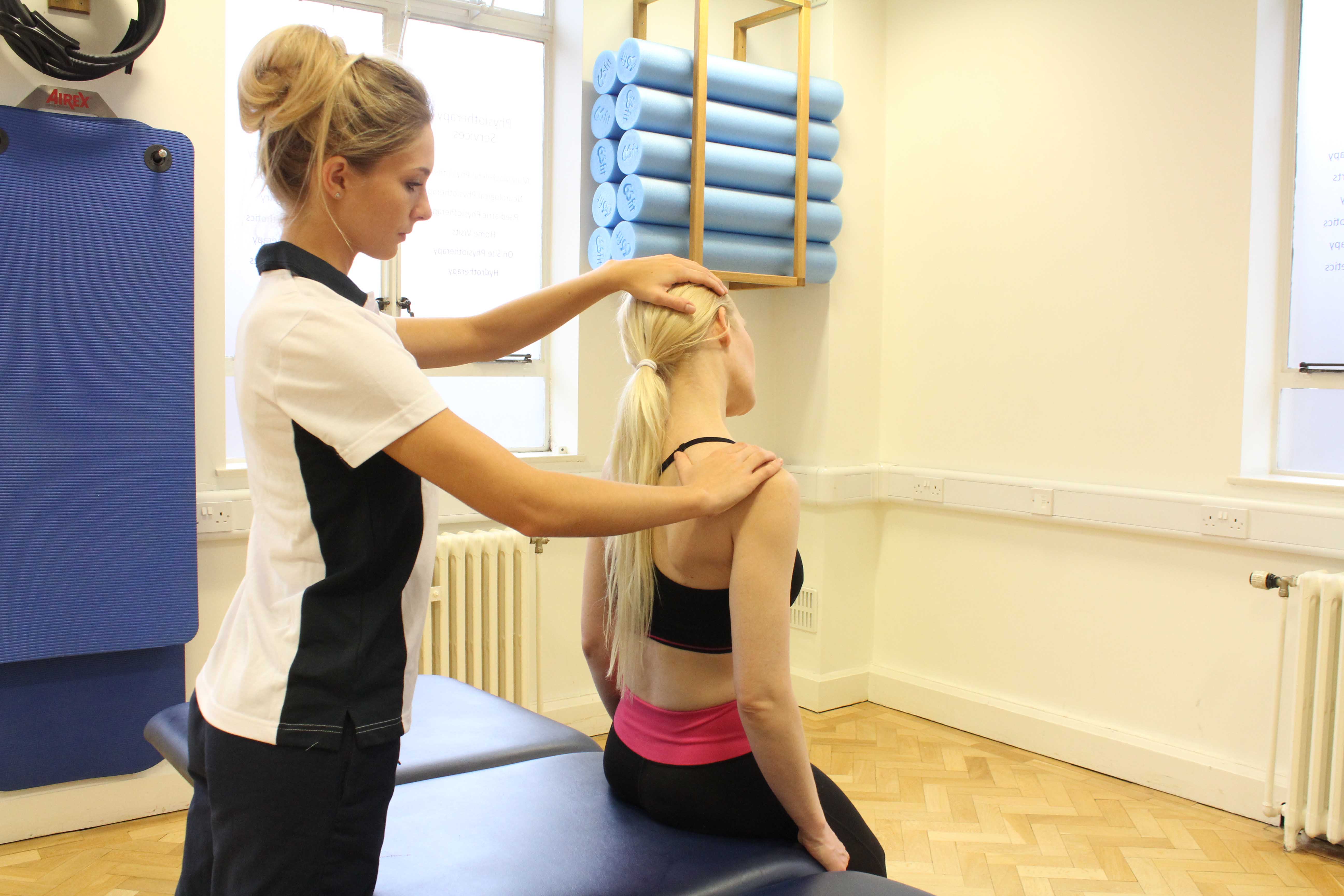 Passive stretch of the trapezius muscle in the neck by experienced therapist